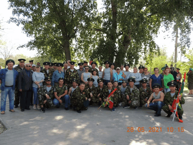 a group of people posing for a picture with the date 28 06 2021