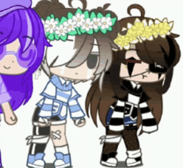 a girl with a flower crown on her head is standing next to two other girls .