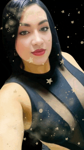 a woman in a black dress with stars on her face