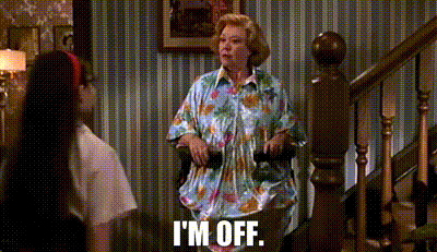 a woman is sitting on a chair in front of a staircase and says `` i 'm off ''