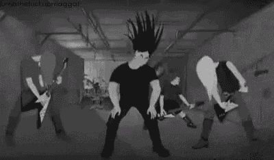 a black and white photo of a metal band playing guitars in a room .