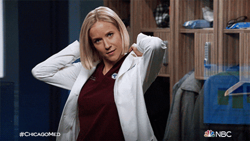 a woman in a lab coat is standing in a locker room with #chicagomed written on the bottom