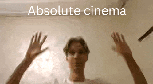 a blurry picture of a person with the words absolute cinema written above them