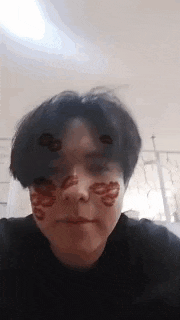 a close up of a person 's face with a mask on it .