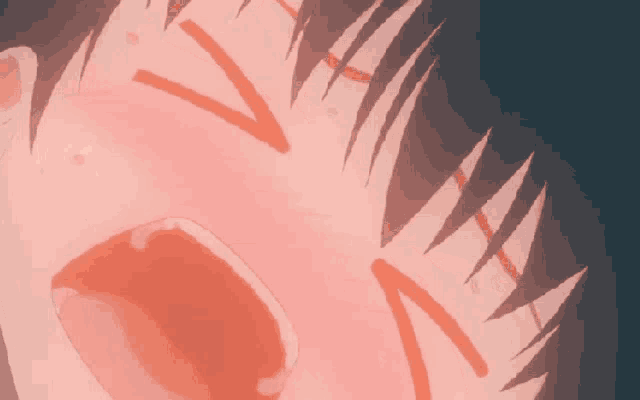 a close up of a person 's face with a red spot on it