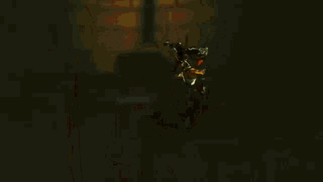 a group of people are standing next to each other in a dark room holding weapons .