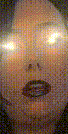 a close up of a woman 's face with a glowing eye