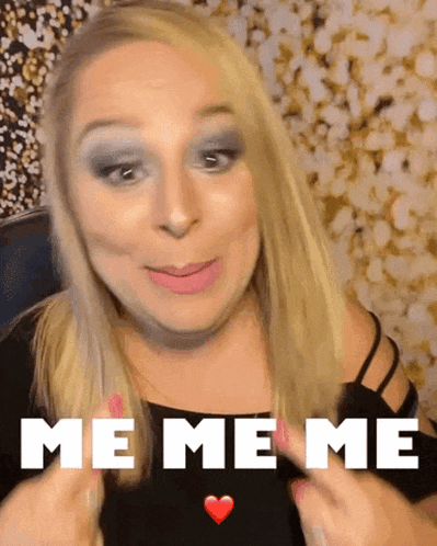 a blonde woman says me me me with a heart in her hand