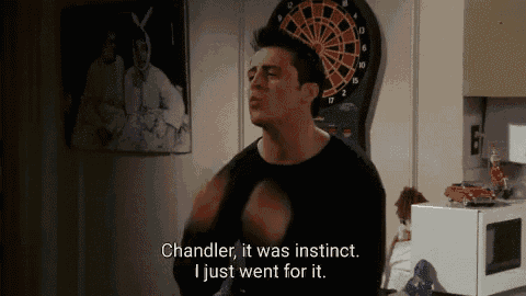 a man standing in front of a dart board says chandler it was instinct i just went for it .