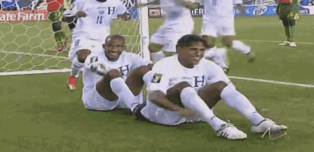 a soccer player with the letter h on his shirt