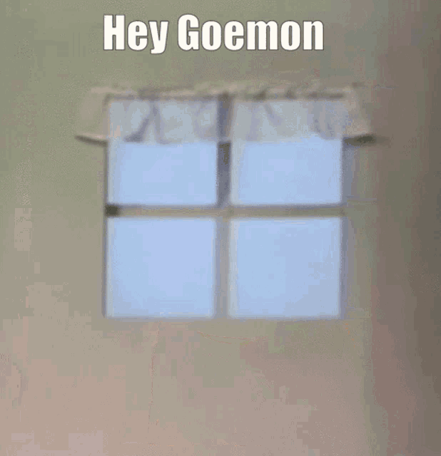a sesame street character is standing in front of a window with the caption hey goemon
