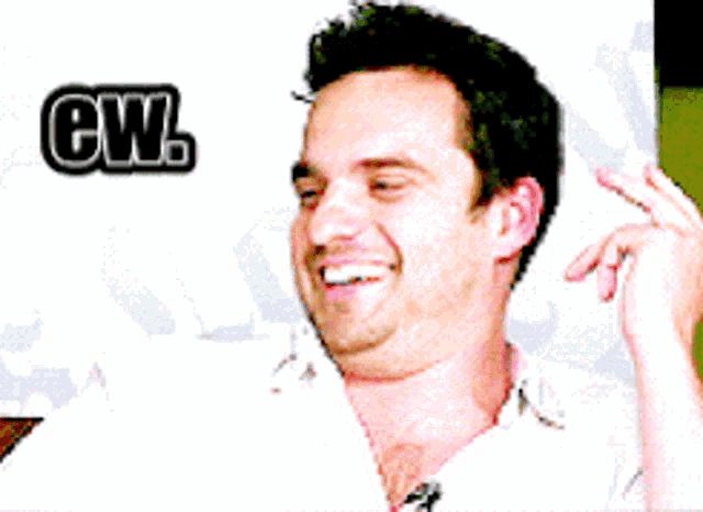 a man making a funny face with the word cwl behind him
