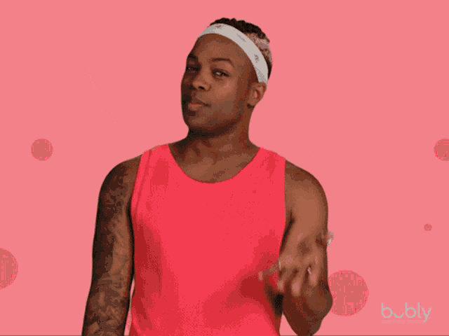 a man in a red tank top with a headband that says ' calvin klein '