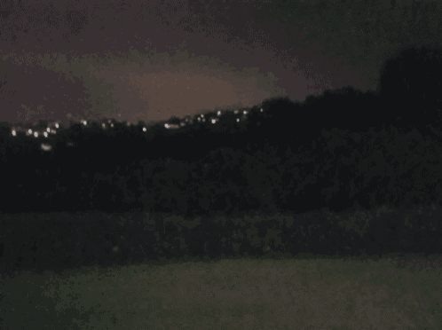 a blurred picture of a field at night