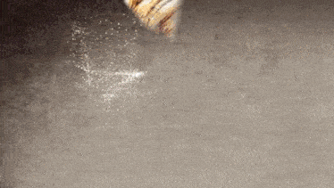 a painting of a cat 's tail with a few drops of water coming out of it