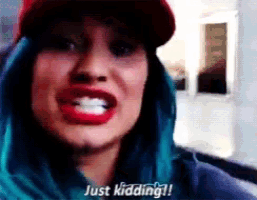 a woman with blue hair says just kidding !