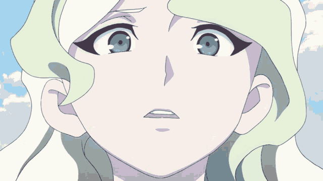 a close up of a girl 's face with a blue sky in the background