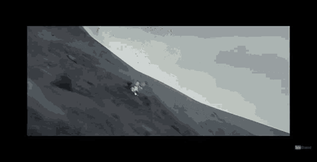 a black and white photo of a mountain with the youtube logo on the bottom