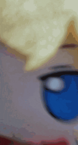 a close up of a person 's face with blue glasses