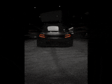 a close up of a black car with a sticker that says srt on it