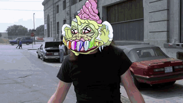 a man wearing a cartoon ice cream cone mask