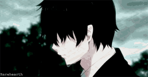 a close up of a person 's face with a tear running down their face .