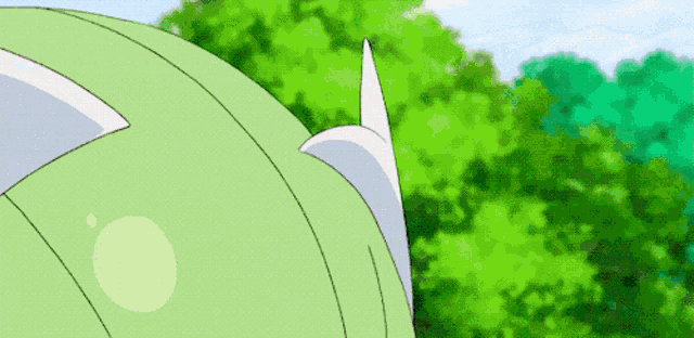 a cartoon character is standing in front of a green forest .