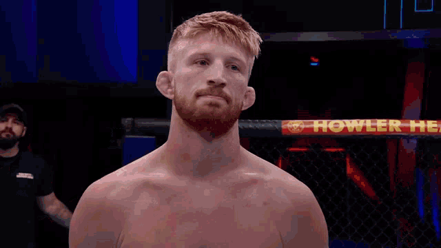 a man in a boxing ring with a sign that says howler on it