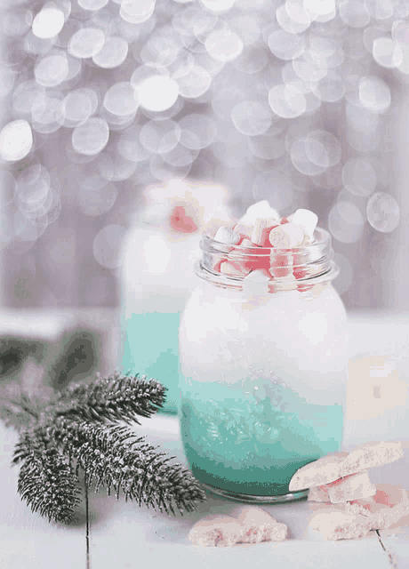 a blue and white drink with marshmallows in it