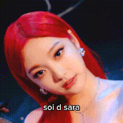a close up of a woman 's face with red hair and the words `` soi d sara '' written on it .