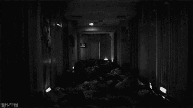 a black and white photo of a hallway with mum-final written on the bottom right