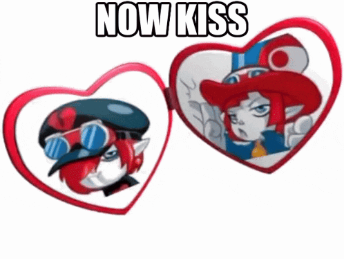 a heart shaped mirror with a cartoon character on it and the words now kiss above it