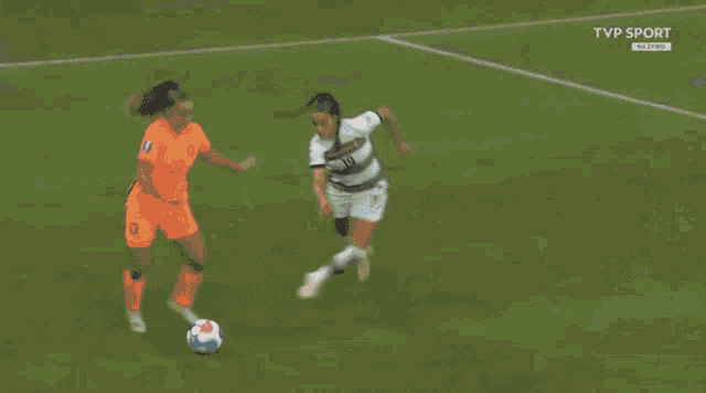 a soccer goalie dives for the ball in front of a volkswagen ad
