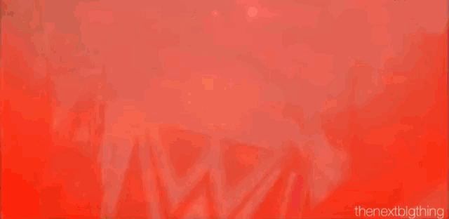 a red background with a w logo on it .
