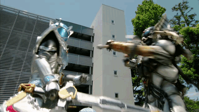 a statue of a knight with a sword stands in front of a building