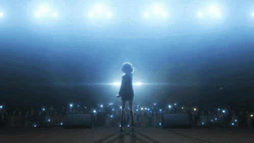 a girl singing into a microphone in front of an audience