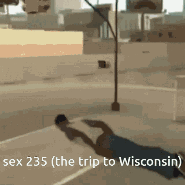 a man is laying on the ground with the words sex 235 ( the trip to wisconsin ) written below him