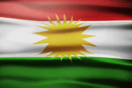 a kurdish flag with a yellow star on it