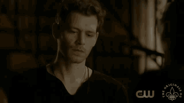 a close up of a man 's face with the words the originals on the bottom right