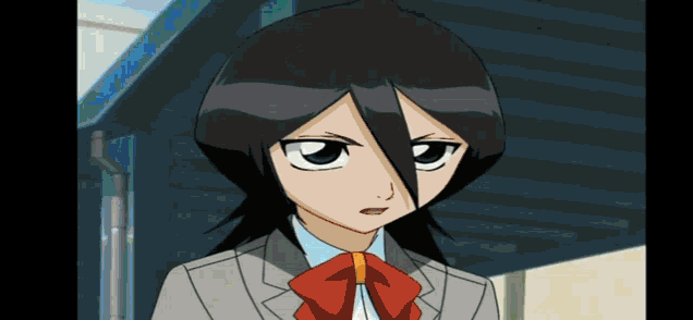 a girl with black hair and a red bow tie is wearing a suit and tie