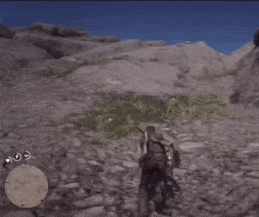 a man in a video game is walking down a rocky hill