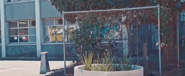 a building with graffiti on the side that says " miami "