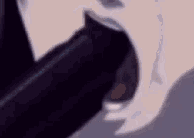 a close up of a person 's mouth with their tongue out .