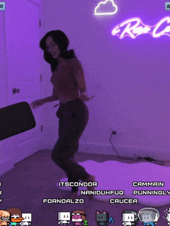 a woman dancing in front of a neon sign that says rc