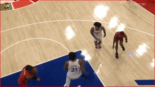 a basketball player with the number 21 on his jersey is jumping in the air
