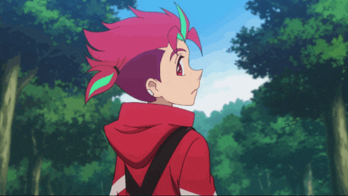 a boy with pink hair and a red hoodie stands in the woods