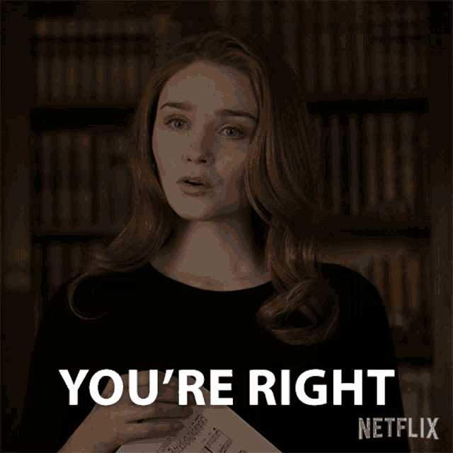 a woman holding a piece of paper with the words " you 're right " written on it