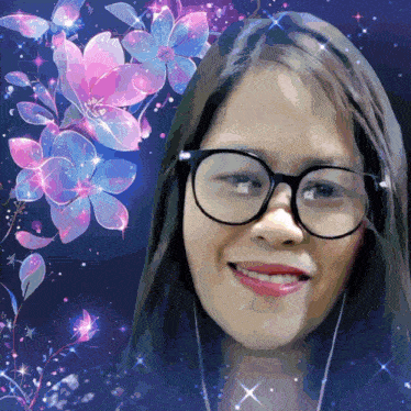 a woman wearing glasses is smiling in front of a floral background