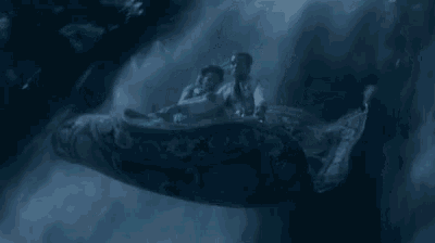 a man and a woman are flying on a carpet in the air