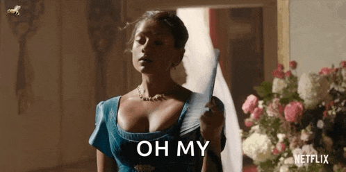 a woman in a blue dress is holding a fan in her hand and says `` oh my '' .